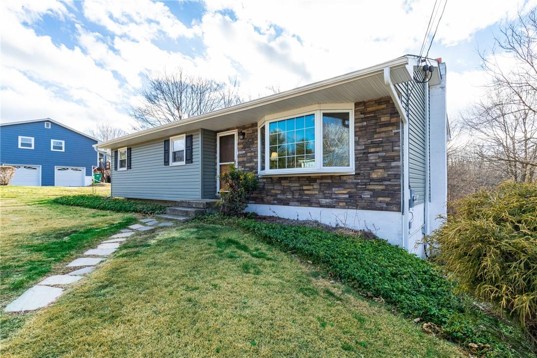 20 Wagon Wheel Road Poughkeepsie, NY 12601 - Photo 1 of 1 a front view of a house with garden