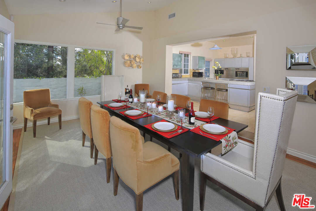 1410 Stradella Road Los Angeles, CA 90077 - Photo 11 of 24 a view of a dining room with furniture window and outside view