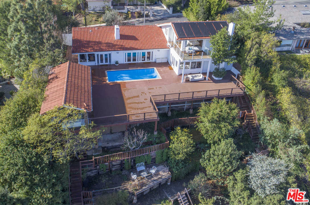 1410 Stradella Road Los Angeles, CA 90077 - Photo 17 of 24 an aerial view of a house with a yard and outdoor seating