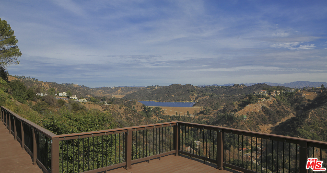 1410 Stradella Road Los Angeles, CA 90077 - Photo 4 of 24 a view of a city and mountain