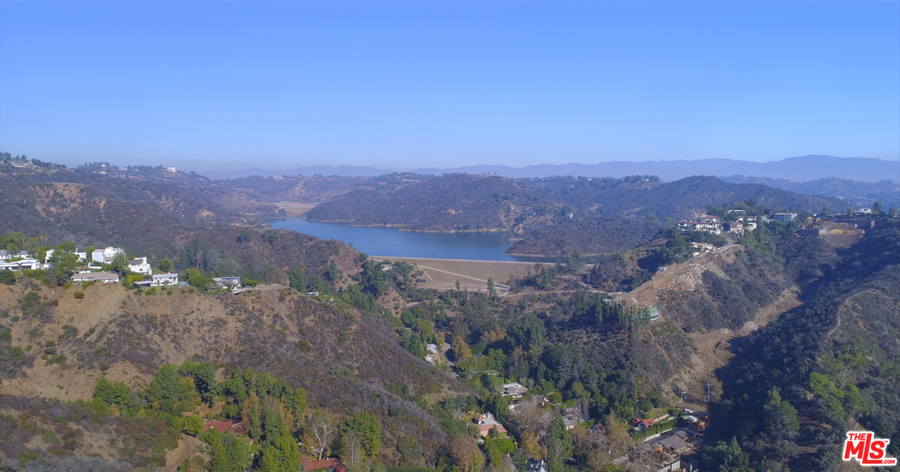 1410 Stradella Road Los Angeles, CA 90077 - Photo 6 of 24 a view of a city with a mountain in the background