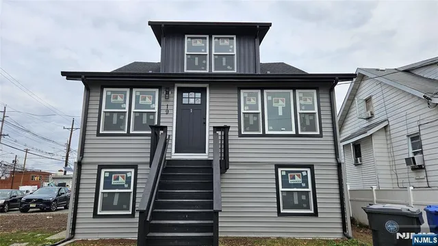 a front view of a house with a porch