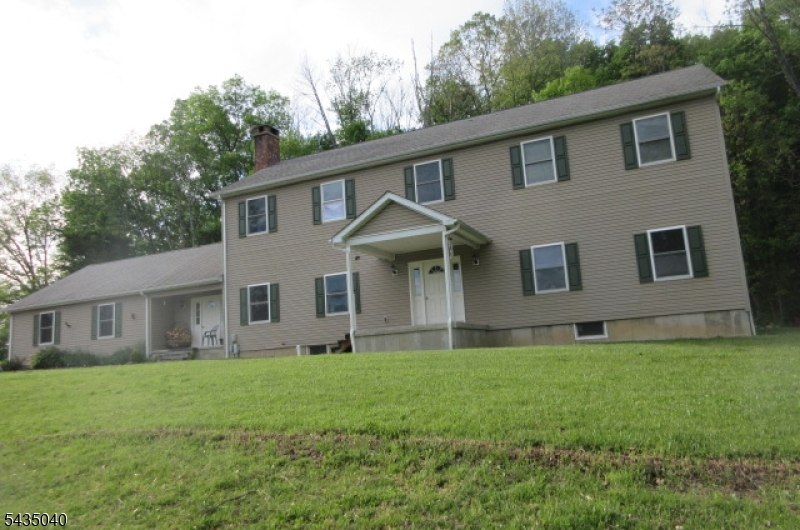 28 Beaver Run Road Lafayette, NJ 07848 - Photo 6 of 36 a front view of a house with a yard and trees