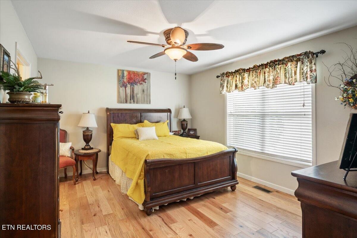 1935 Cozy Road Newport, TN 37821 - Photo 12 of 33 a bedroom with a bed and a chandelier