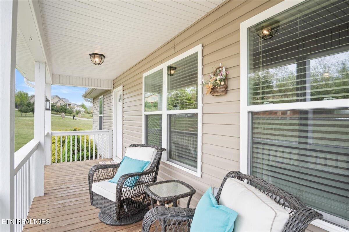 1935 Cozy Road Newport, TN 37821 - Photo 3 of 33 a view of a chair and tables in the balcony