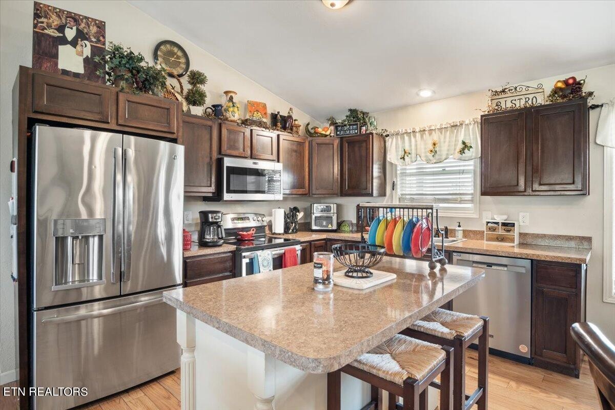 1935 Cozy Road Newport, TN 37821 - Photo 8 of 33 a kitchen with stainless steel appliances granite countertop a refrigerator stove top oven a sink and dishwasher
