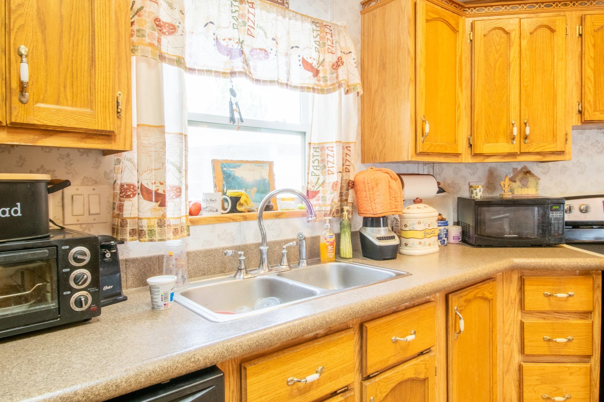 435 32 Road, Unit 437 Clifton, CO 81520 - Photo 11 of 29 a kitchen with a sink and a window
