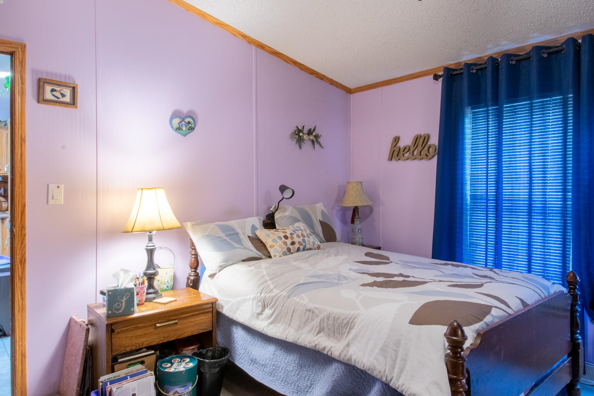 435 32 Road, Unit 437 Clifton, CO 81520 - Photo 16 of 29 a bedroom with a bed and a window