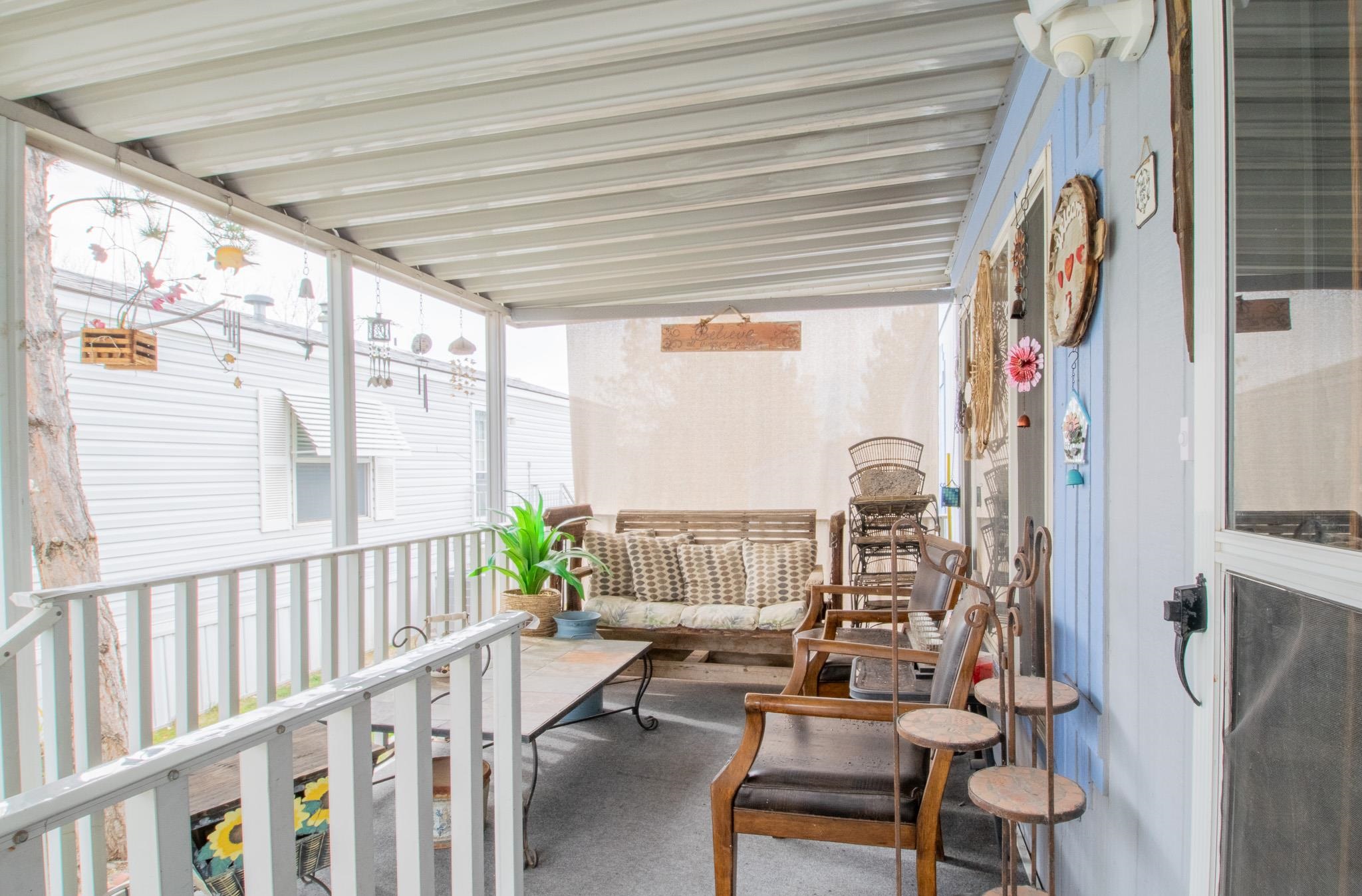 435 32 Road, Unit 437 Clifton, CO 81520 - Photo 2 of 29 a living room with furniture and a window
