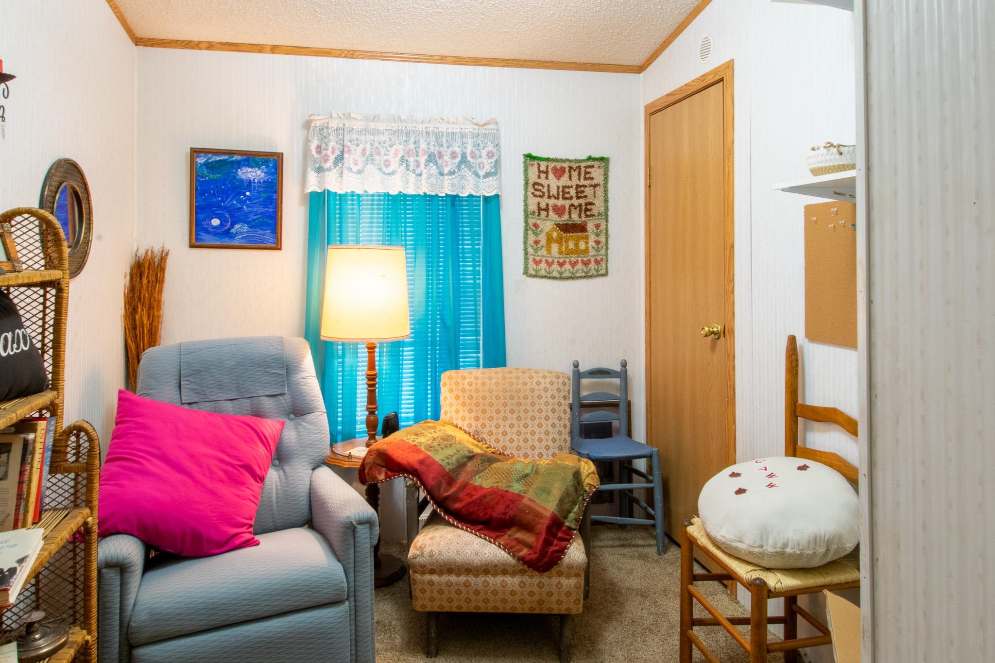 435 32 Road, Unit 437 Clifton, CO 81520 - Photo 24 of 29 a bedroom with a bed and couch