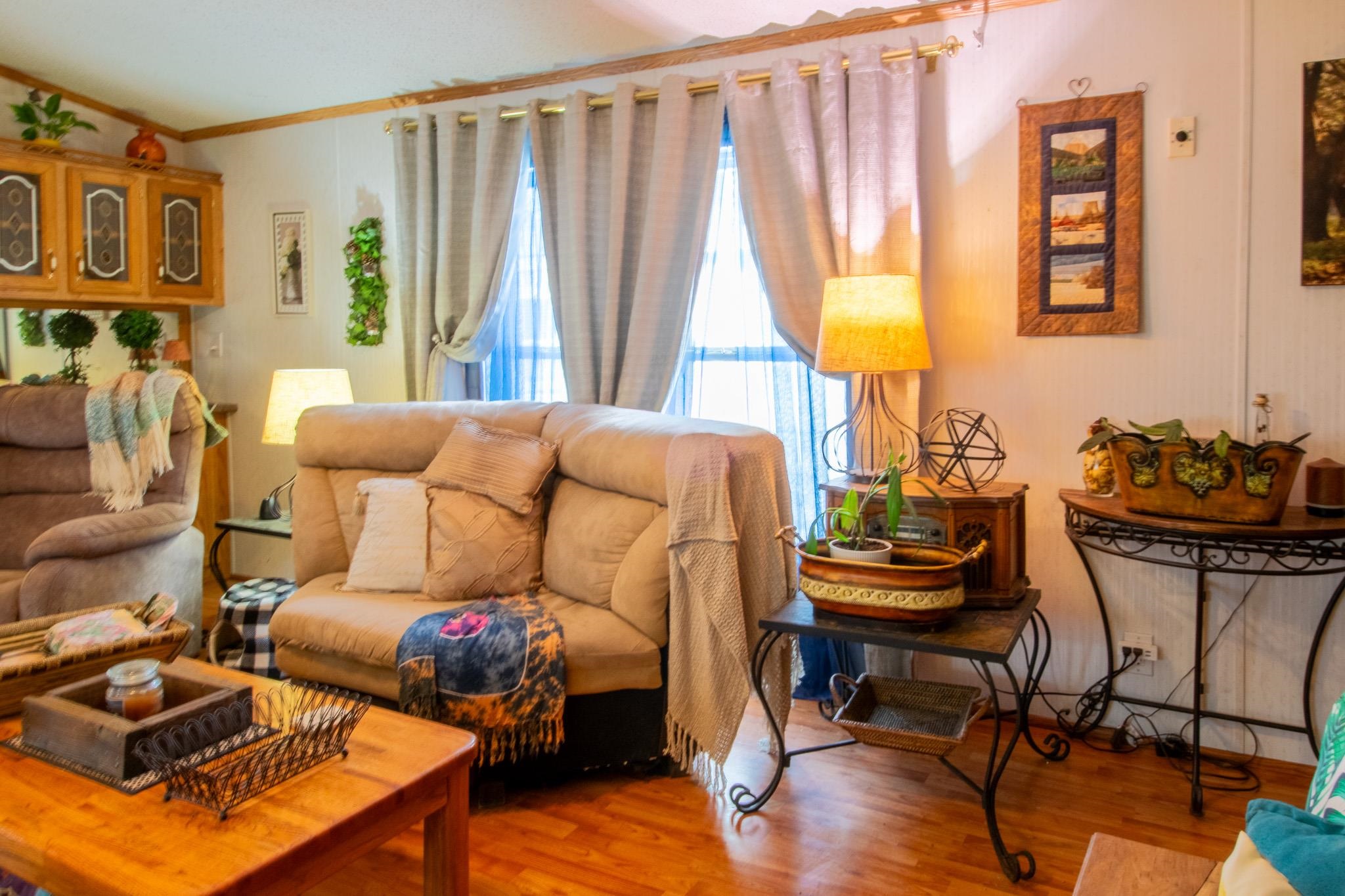 435 32 Road, Unit 437 Clifton, CO 81520 - Photo 4 of 29 a living room with furniture and a window