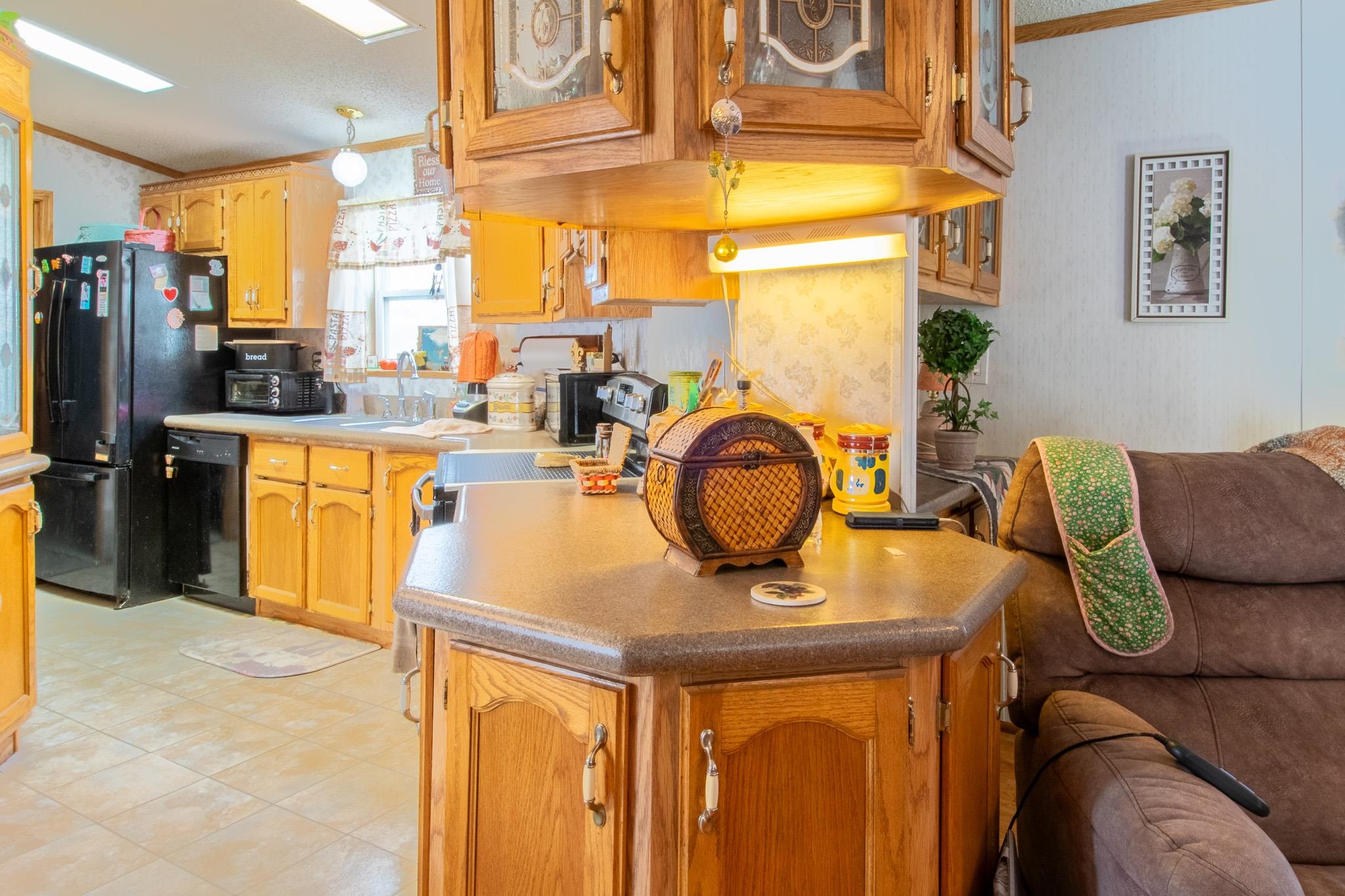 435 32 Road, Unit 437 Clifton, CO 81520 - Photo 8 of 29 a living room with a couch and a dining table