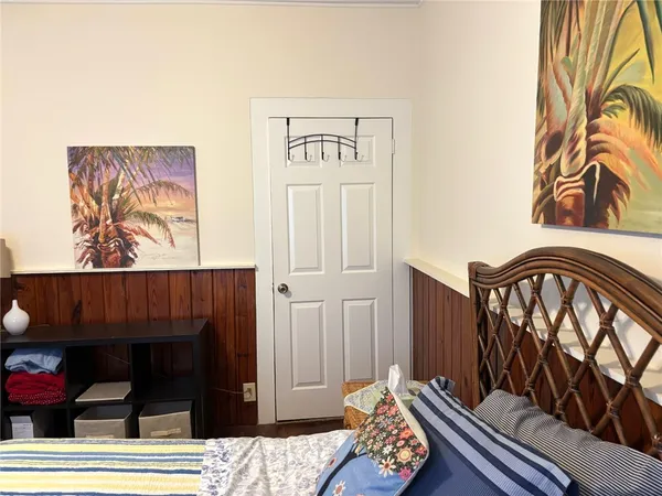 a view of an entryway with wooden floor