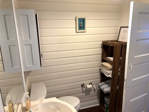 a bathroom with a sink and mirror