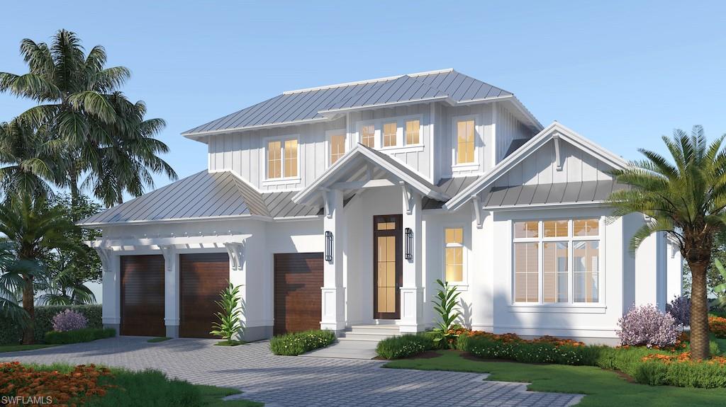 1880 Crayton Road Naples, FL 34102 - Photo 1 of 4 a front view of a house with yard and green space