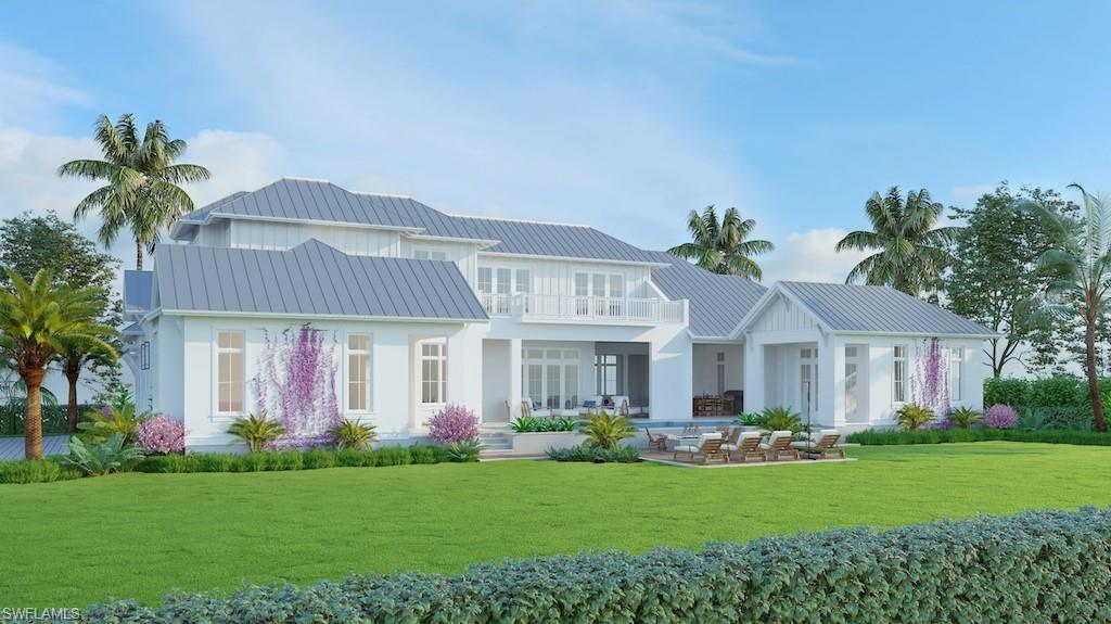1880 Crayton Road Naples, FL 34102 - Photo 2 of 4 a front view of a house with a garden and porch