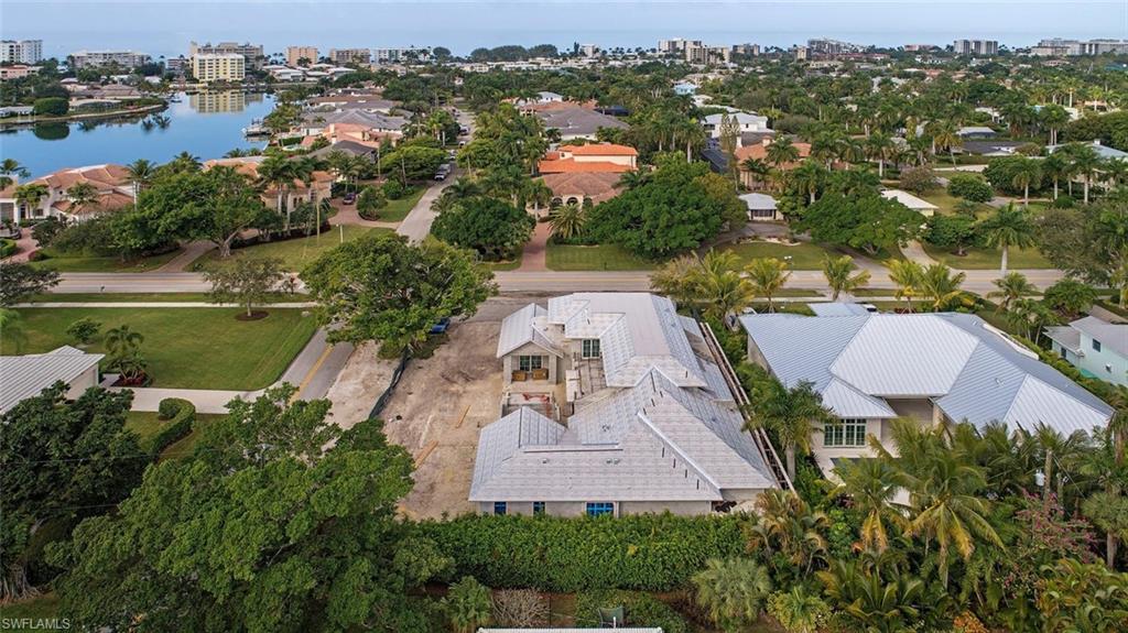 1880 Crayton Road Naples, FL 34102 - Photo 4 of 4 an aerial view of residential house with outdoor space and swimming pool