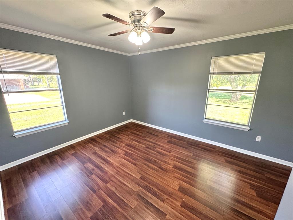 4170 Farm To Market 51 Decatur, TX 76234 - Photo 24 of 36 a view of an empty room with wooden floor and a window
