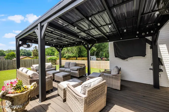 a outdoor living space with furniture and garden view