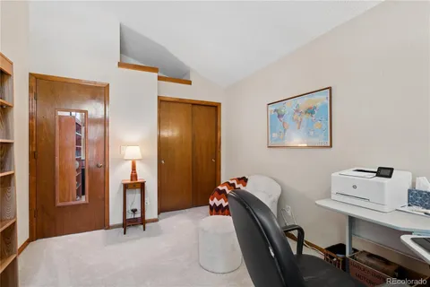 a bedroom with a workspace