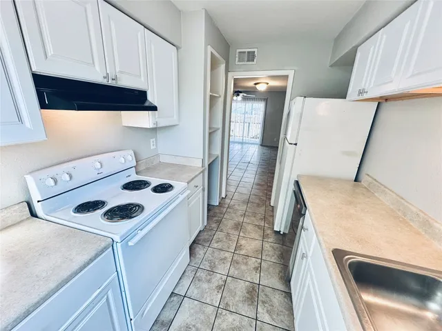 a bathroom with a sink toilet and mirror