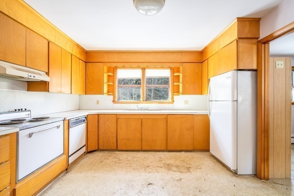 85 Charlton Road Dudley, MA 01571 - Photo 15 of 27 a kitchen with stainless steel appliances granite countertop a refrigerator and a sink