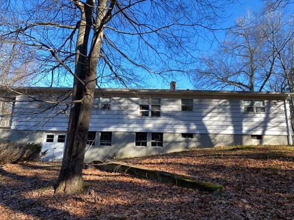 85 Charlton Road Dudley, MA 01571 - Photo 4 of 27 a view of a house with a yard