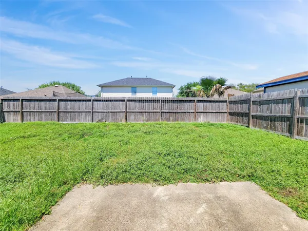 a view of a backyard with a garden and plants