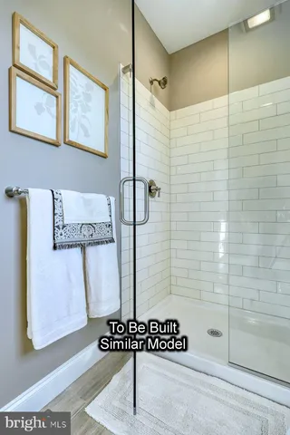 a bathroom with a shower and a sink