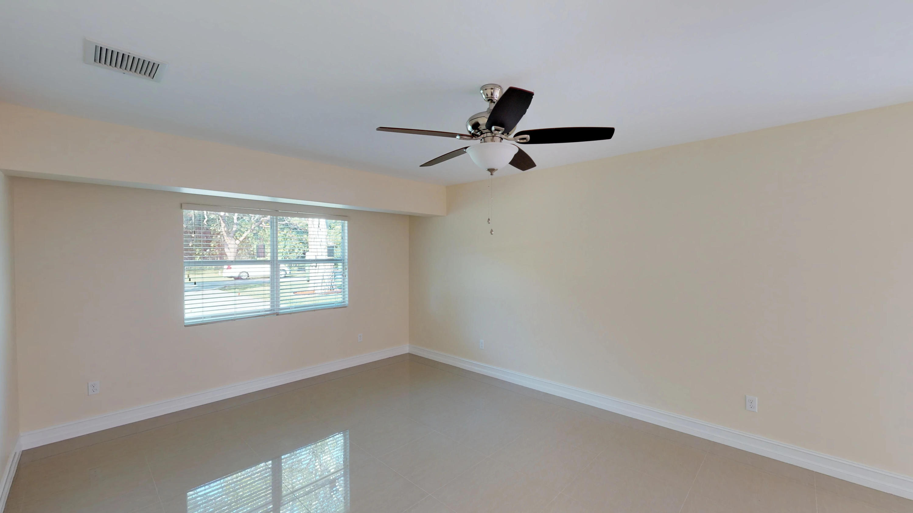 3082 Rostan Lane Palm Springs, FL 33461 - Photo 15 of 20 a view of an empty room with a window