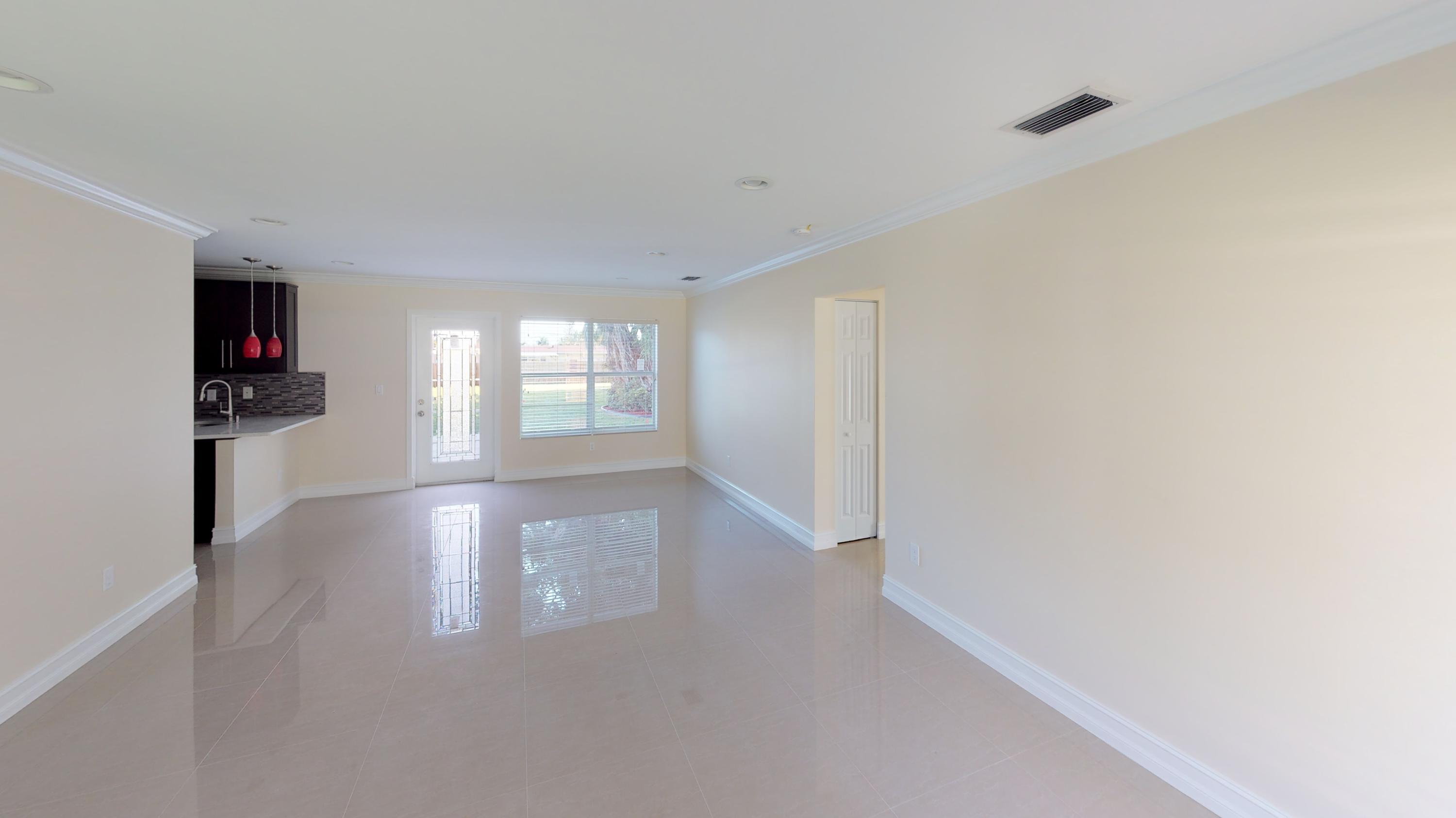3082 Rostan Lane Palm Springs, FL 33461 - Photo 16 of 20 a view of livingroom with hardwood floor and window