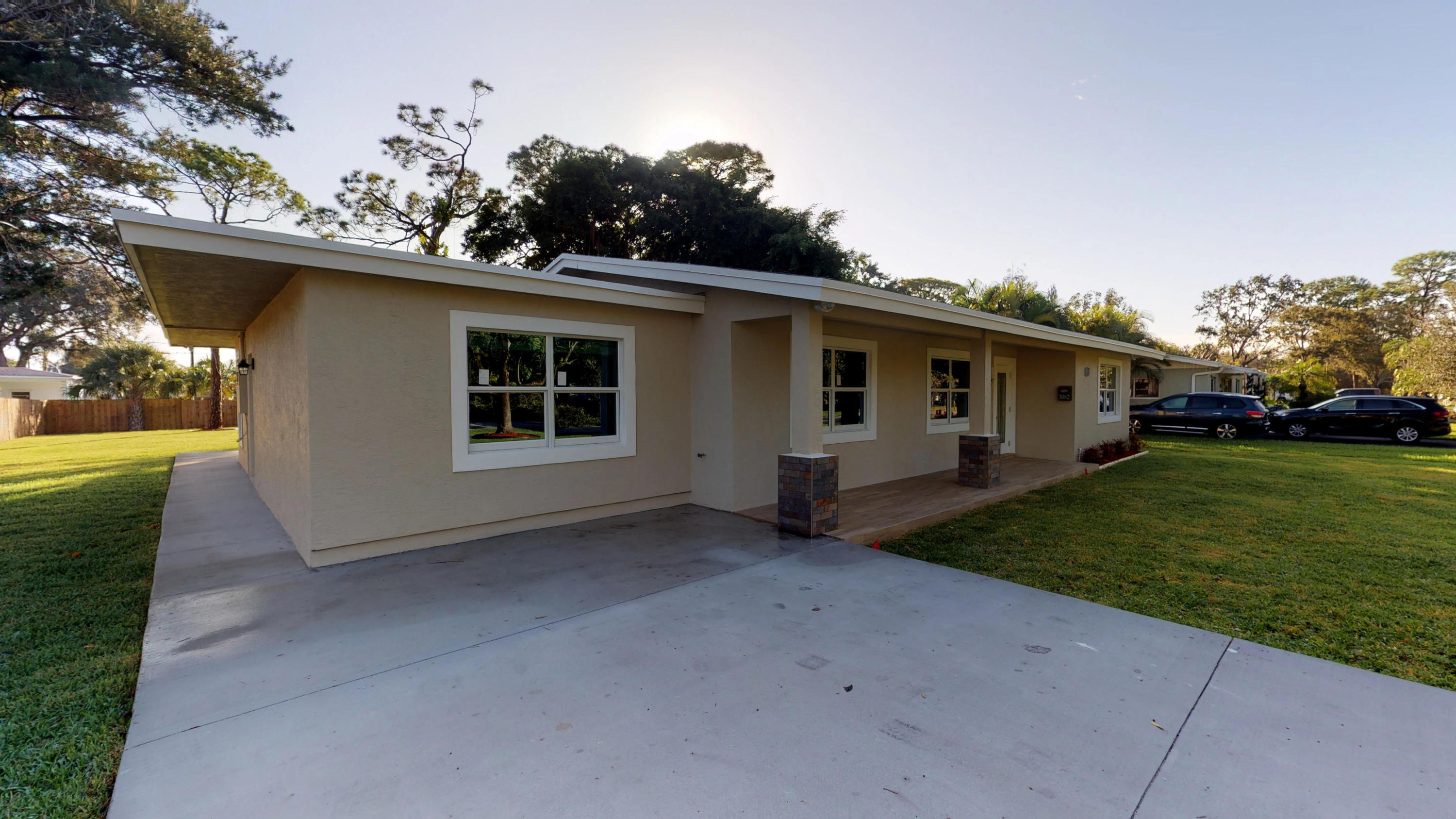 3082 Rostan Lane Palm Springs, FL 33461 - Photo 3 of 20 a view of a house with a backyard