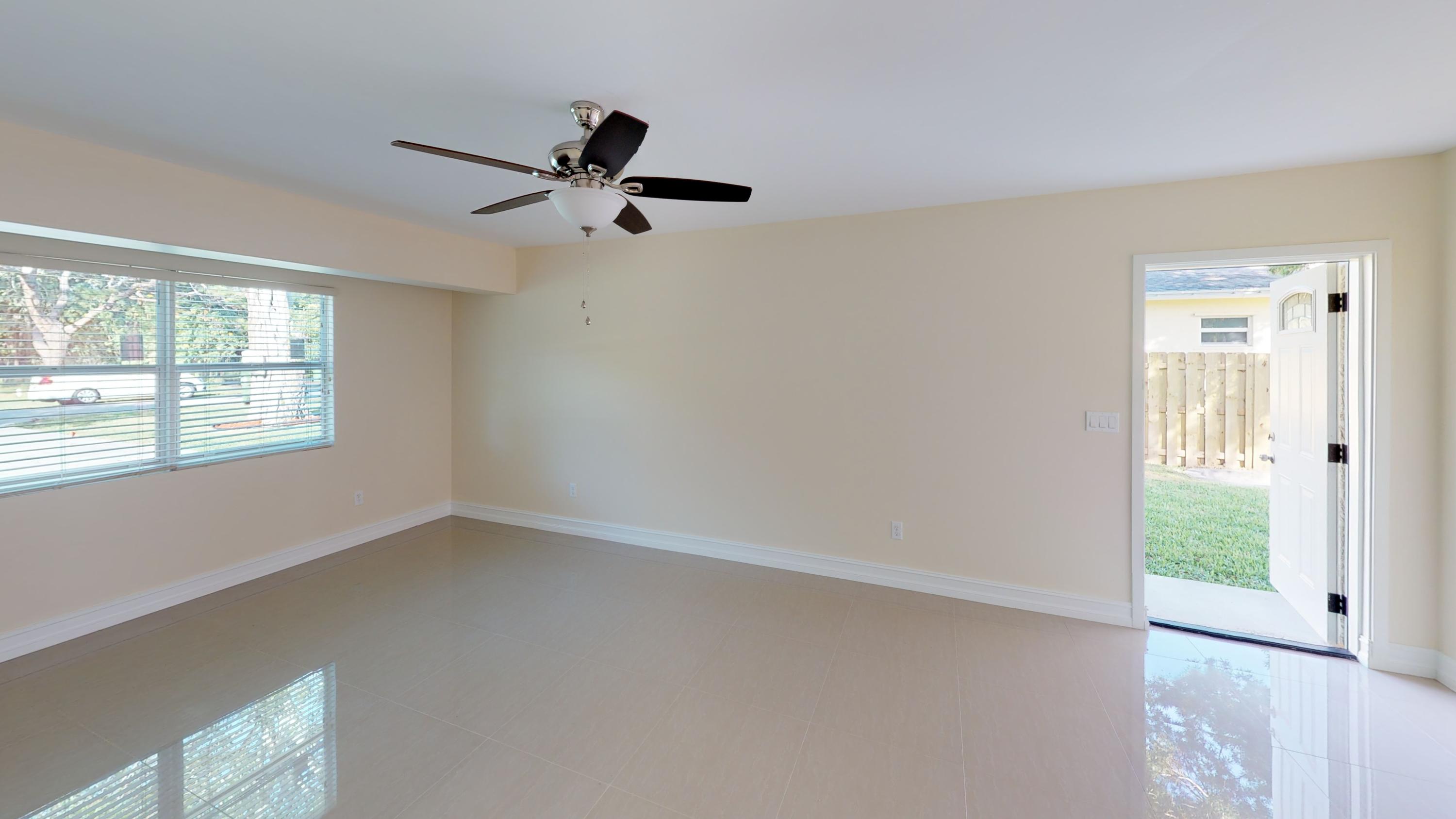 3082 Rostan Lane Palm Springs, FL 33461 - Photo 5 of 20 a view of an empty room with a window