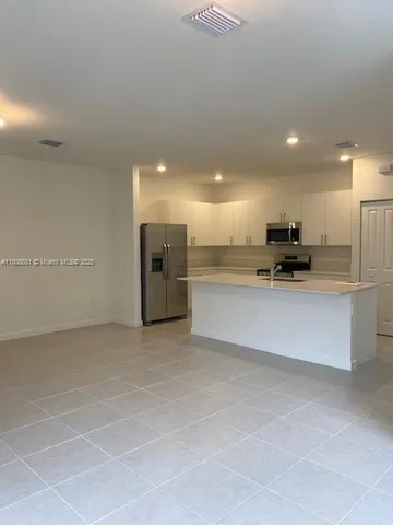 a white toilet sitting next to a bath tub