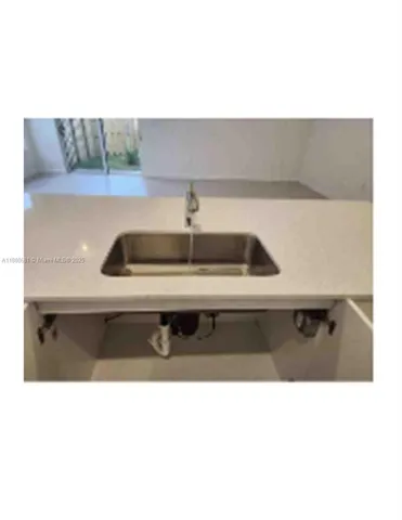 a bathroom with a toilet a sink and bathtub