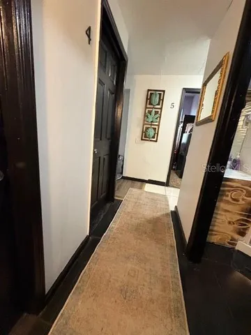 a view of gallery with wooden floor