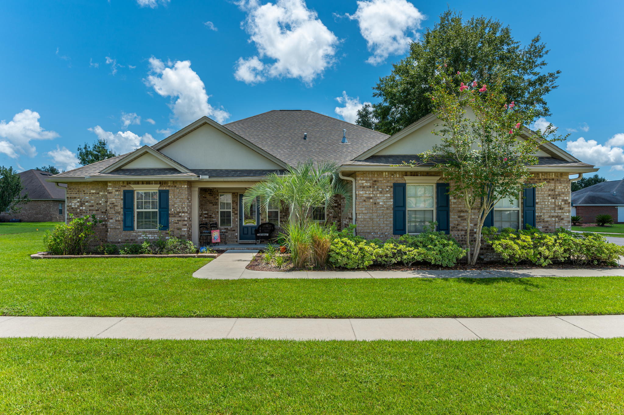 4615 Chanan Drive Crestview, FL 32539 - Photo 1 of 47 a front view of a house with a yard