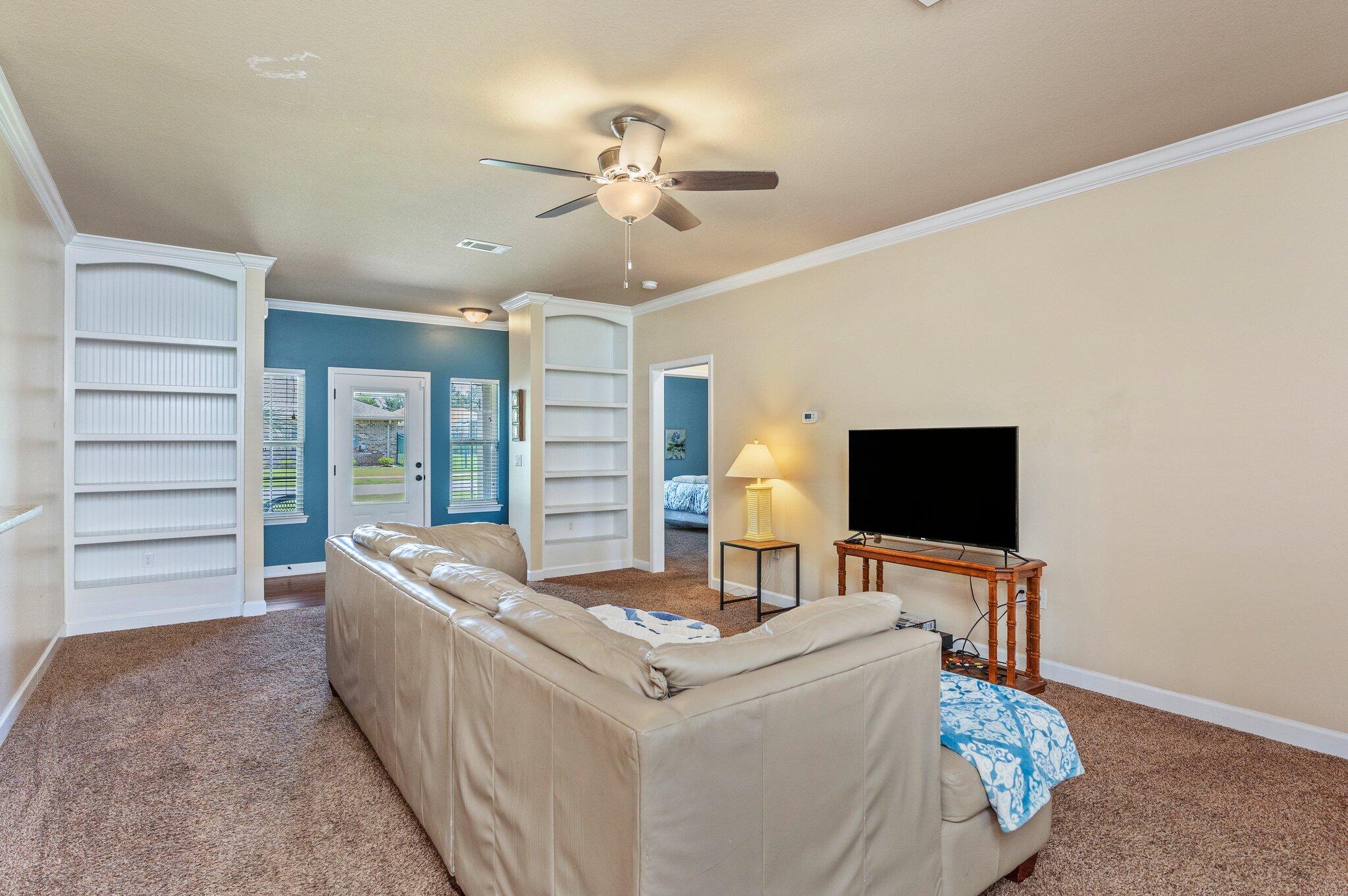 4615 Chanan Drive Crestview, FL 32539 - Photo 12 of 47 a living room with furniture and a flat screen tv