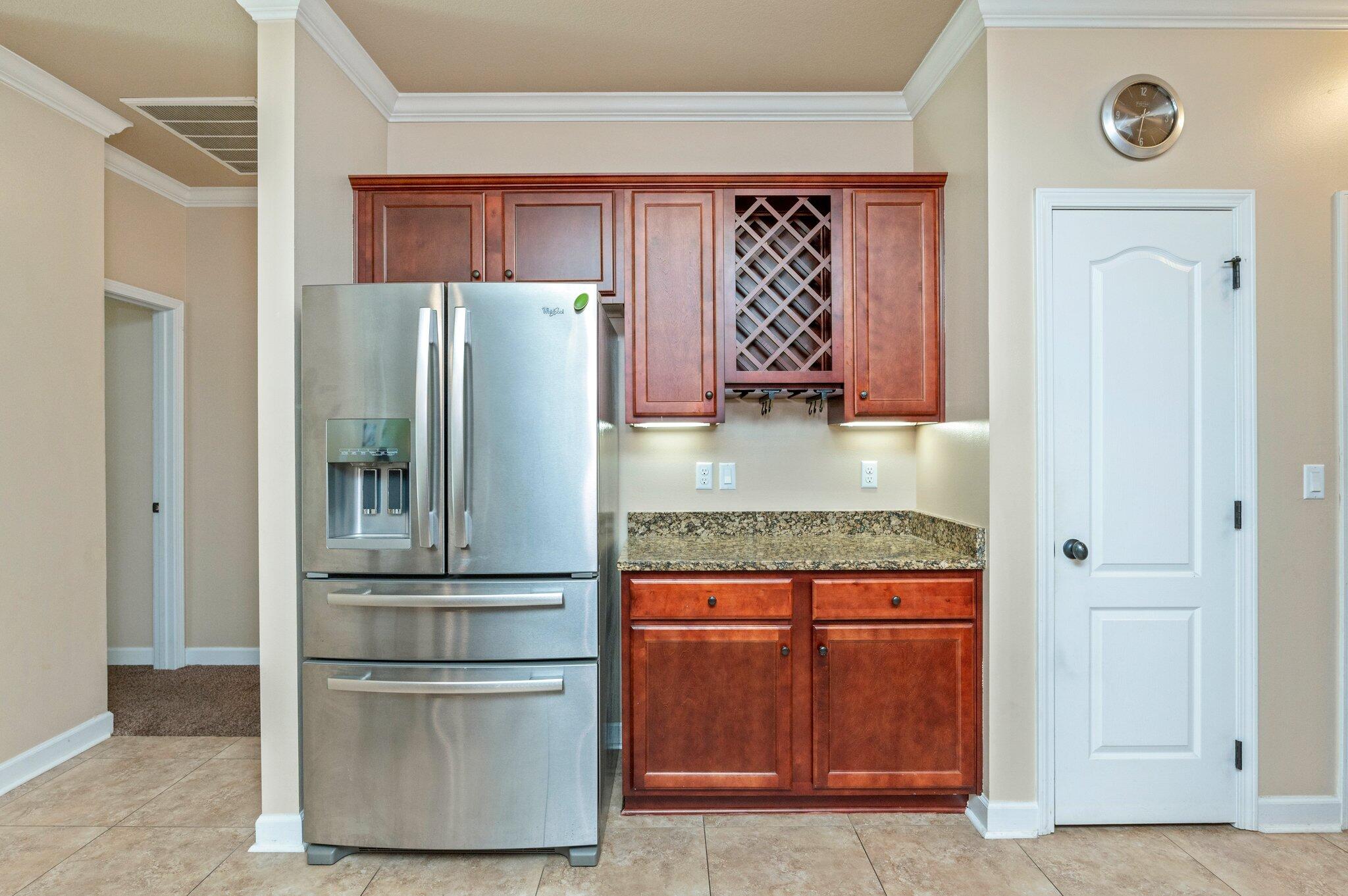 4615 Chanan Drive Crestview, FL 32539 - Photo 18 of 47 a kitchen with stainless steel appliances granite countertop a refrigerator and a stove