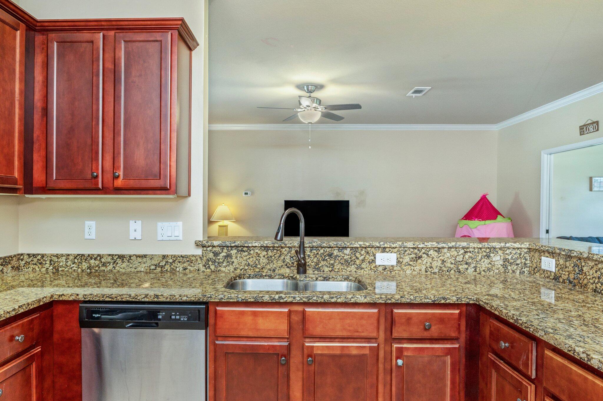 4615 Chanan Drive Crestview, FL 32539 - Photo 19 of 47 a kitchen with stainless steel appliances granite countertop a sink and cabinets
