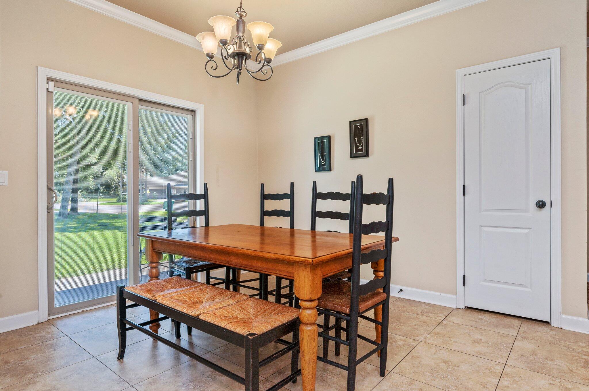 4615 Chanan Drive Crestview, FL 32539 - Photo 21 of 47 a view of a dining room with furniture window and outside view