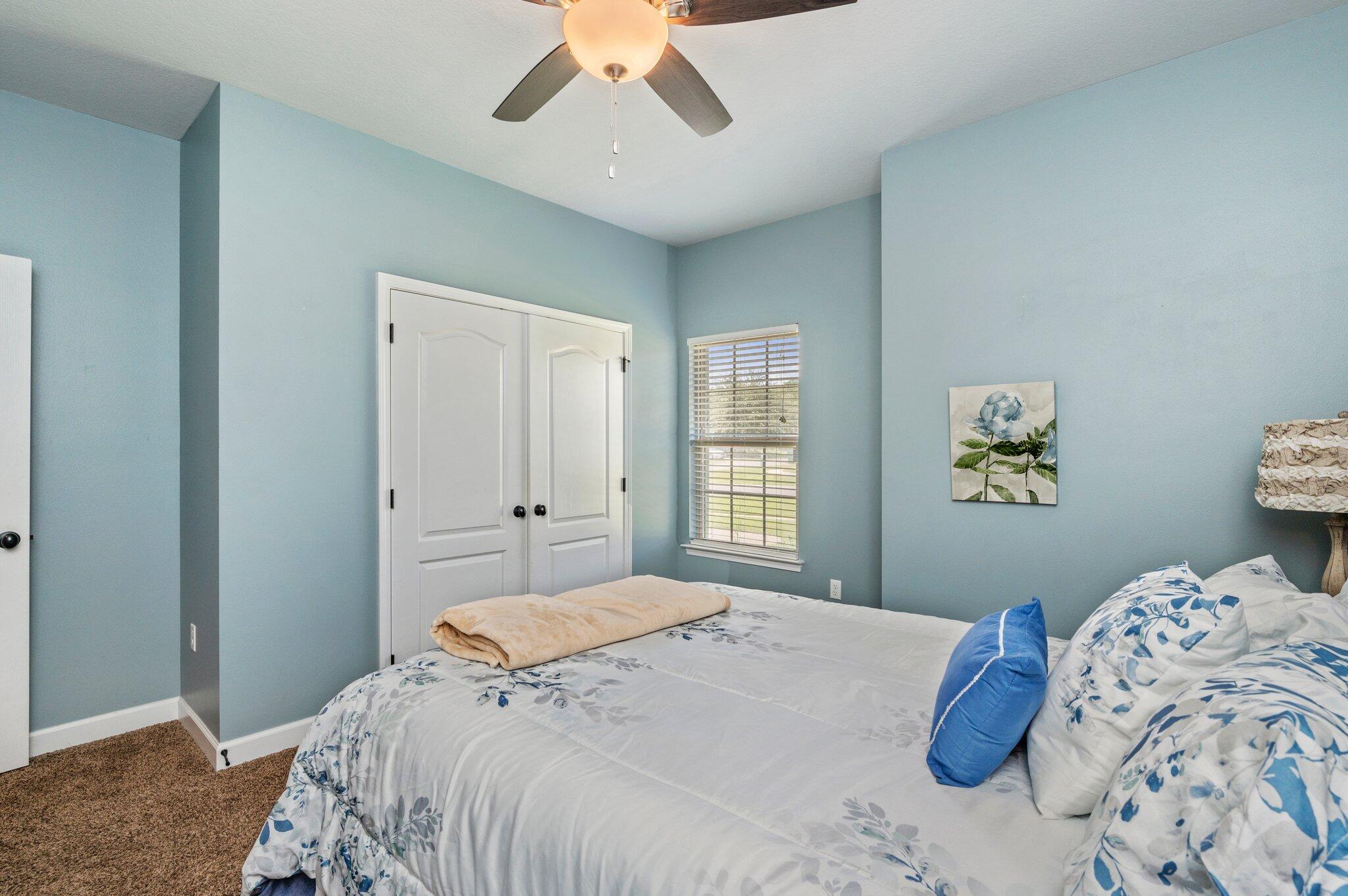 4615 Chanan Drive Crestview, FL 32539 - Photo 23 of 47 a bedroom with a large bed and a window