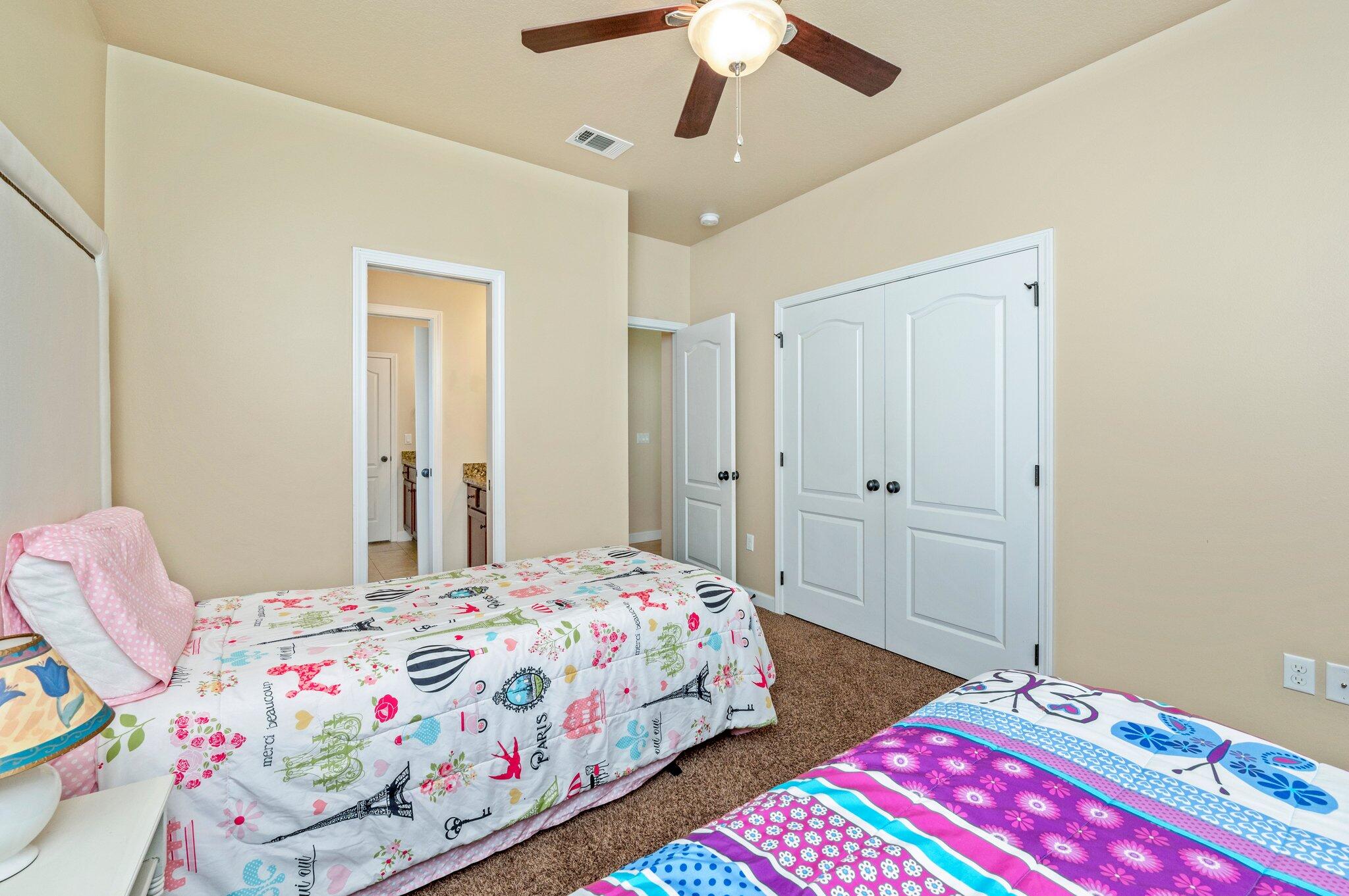 4615 Chanan Drive Crestview, FL 32539 - Photo 36 of 47 a bedroom with a bed and a chandelier
