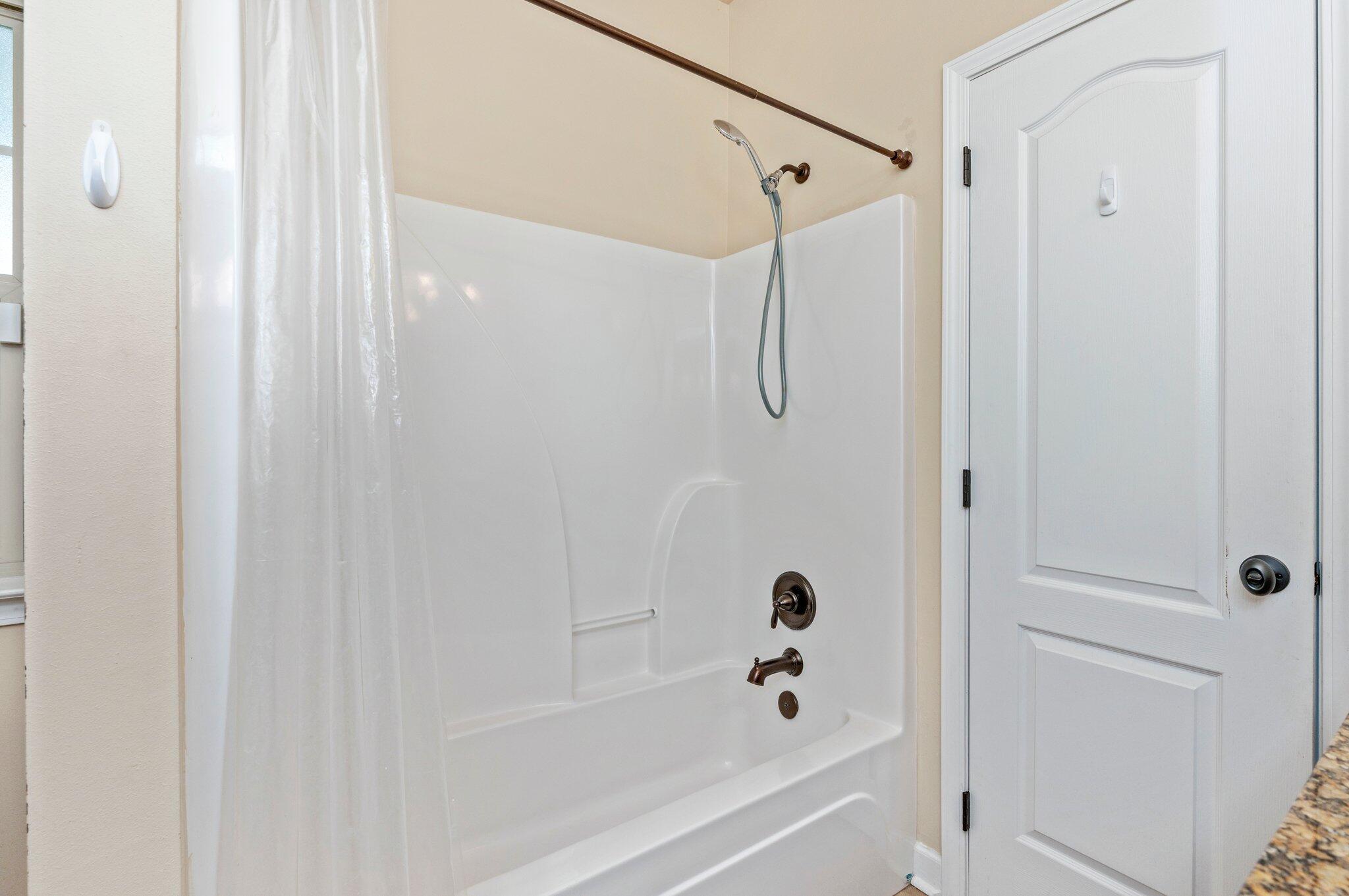 4615 Chanan Drive Crestview, FL 32539 - Photo 39 of 47 a bathroom with a bathtub and a shower