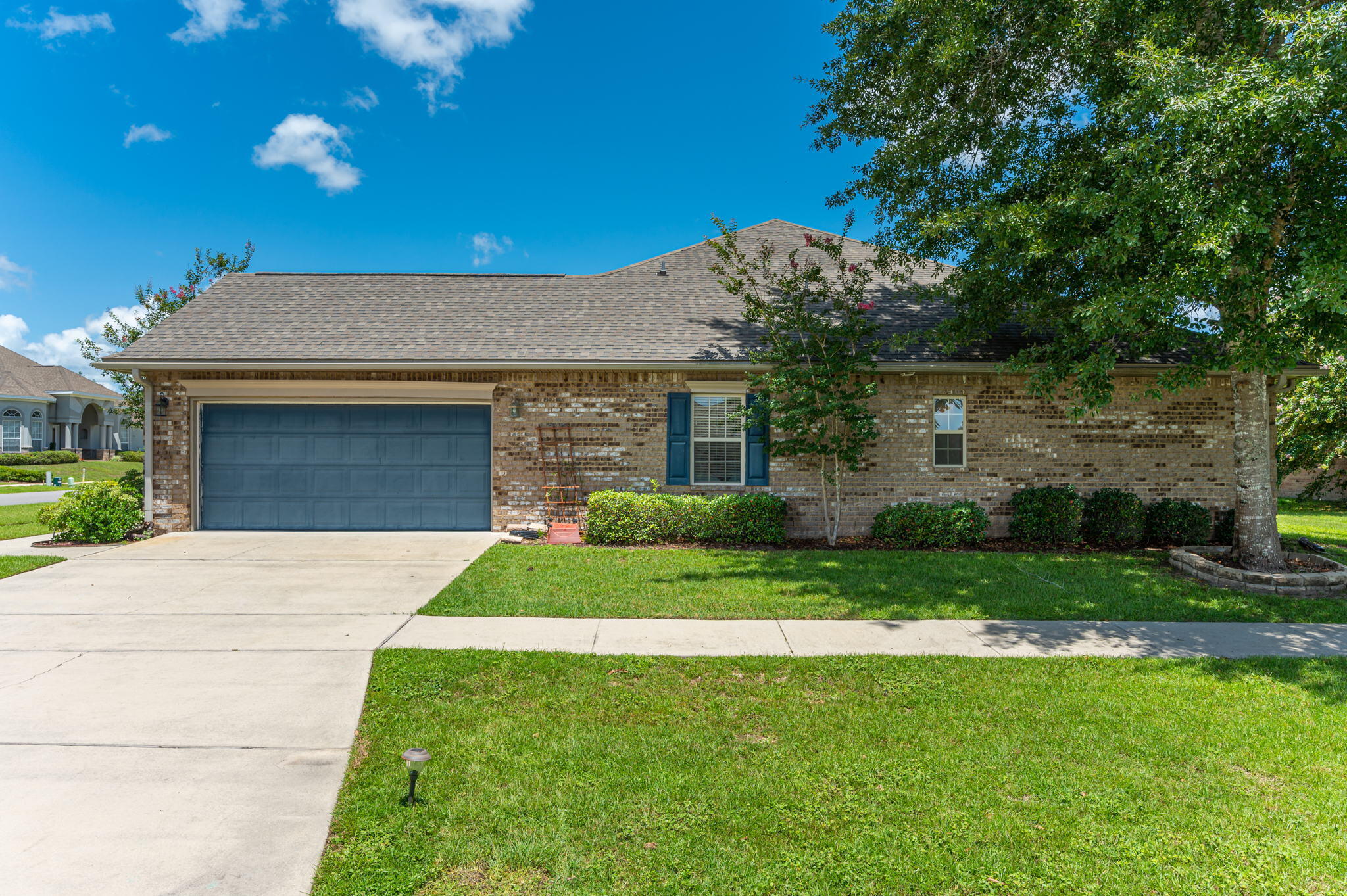 4615 Chanan Drive Crestview, FL 32539 - Photo 4 of 47 a front view of a house with a garden and yard