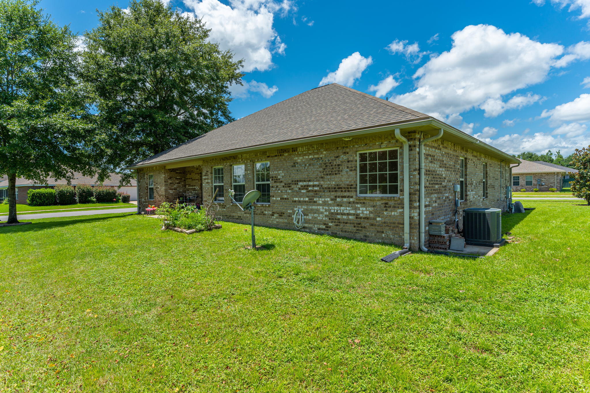 4615 Chanan Drive Crestview, FL 32539 - Photo 46 of 47 a view of a house with backyard and a tree