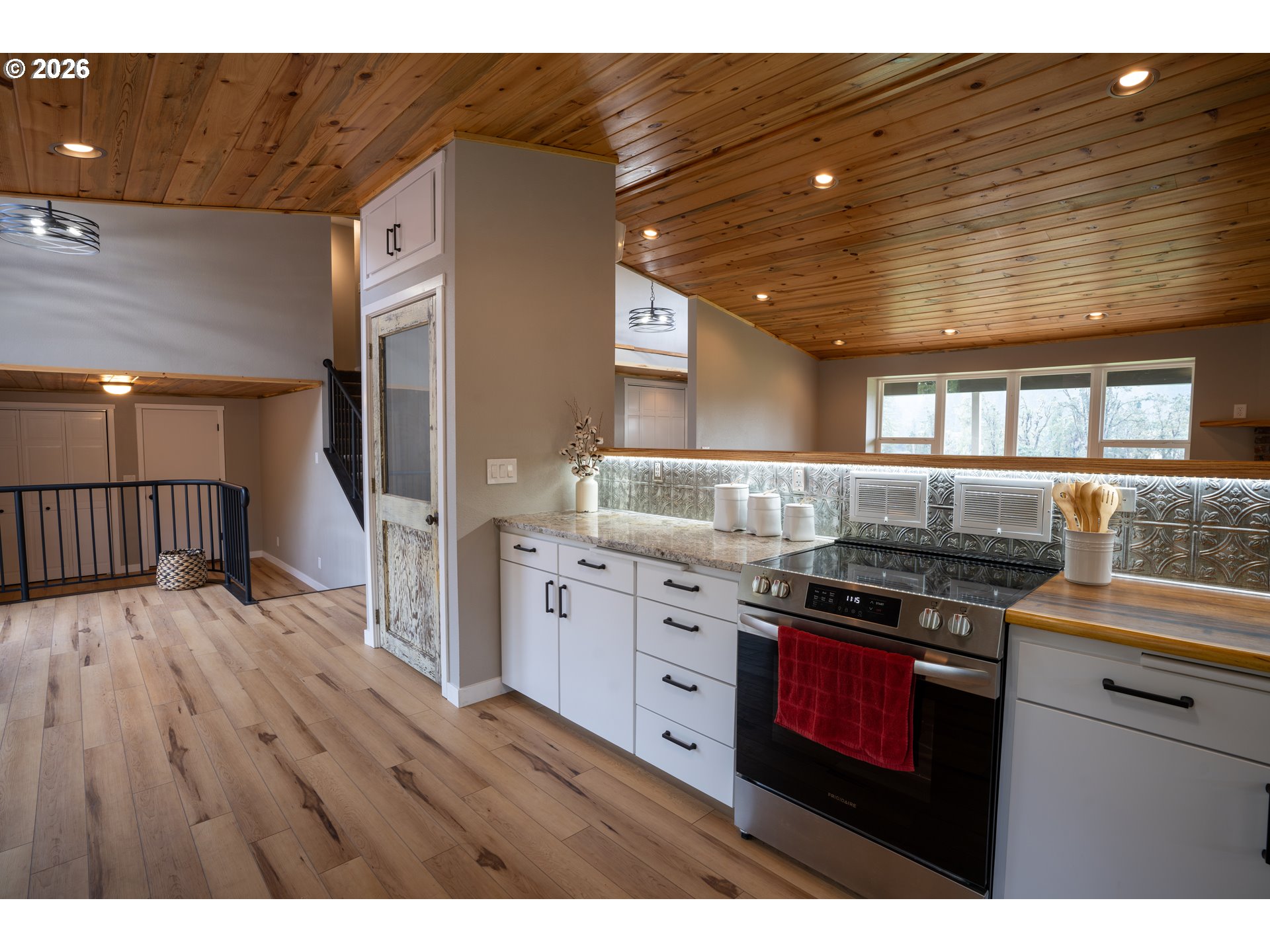 37075 Camp Creek Road Springfield, OR 97478 - Photo 12 of 48 a kitchen with stainless steel appliances granite countertop a stove and cabinets