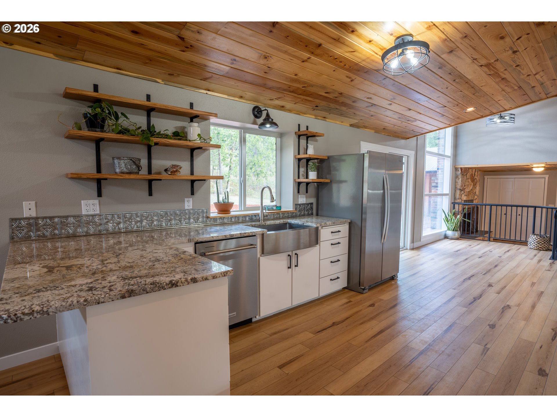 37075 Camp Creek Road Springfield, OR 97478 - Photo 13 of 48 a kitchen with stainless steel appliances granite countertop a sink and wooden cabinets