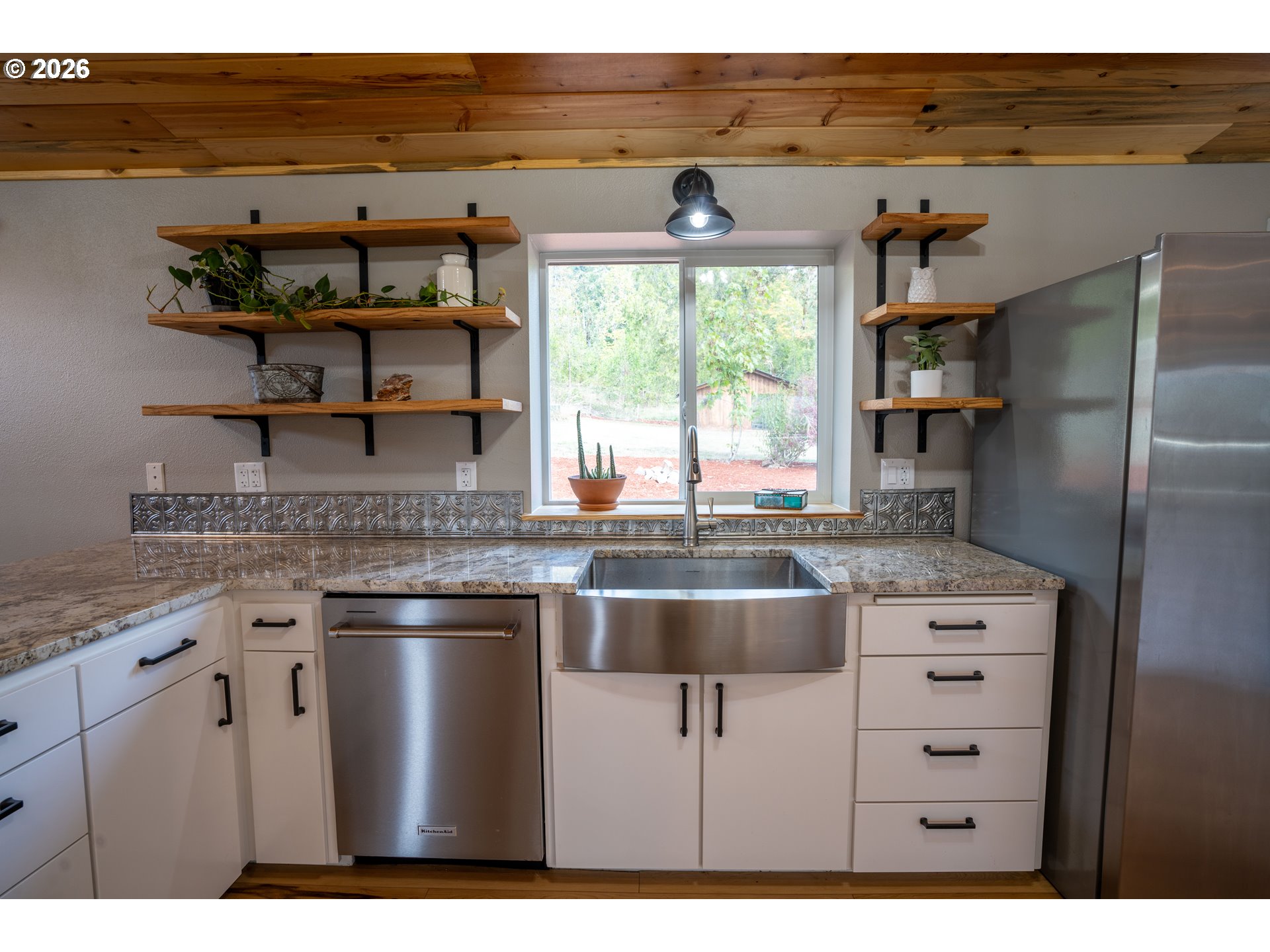 37075 Camp Creek Road Springfield, OR 97478 - Photo 14 of 48 a kitchen with stainless steel appliances granite countertop a sink stove and refrigerator