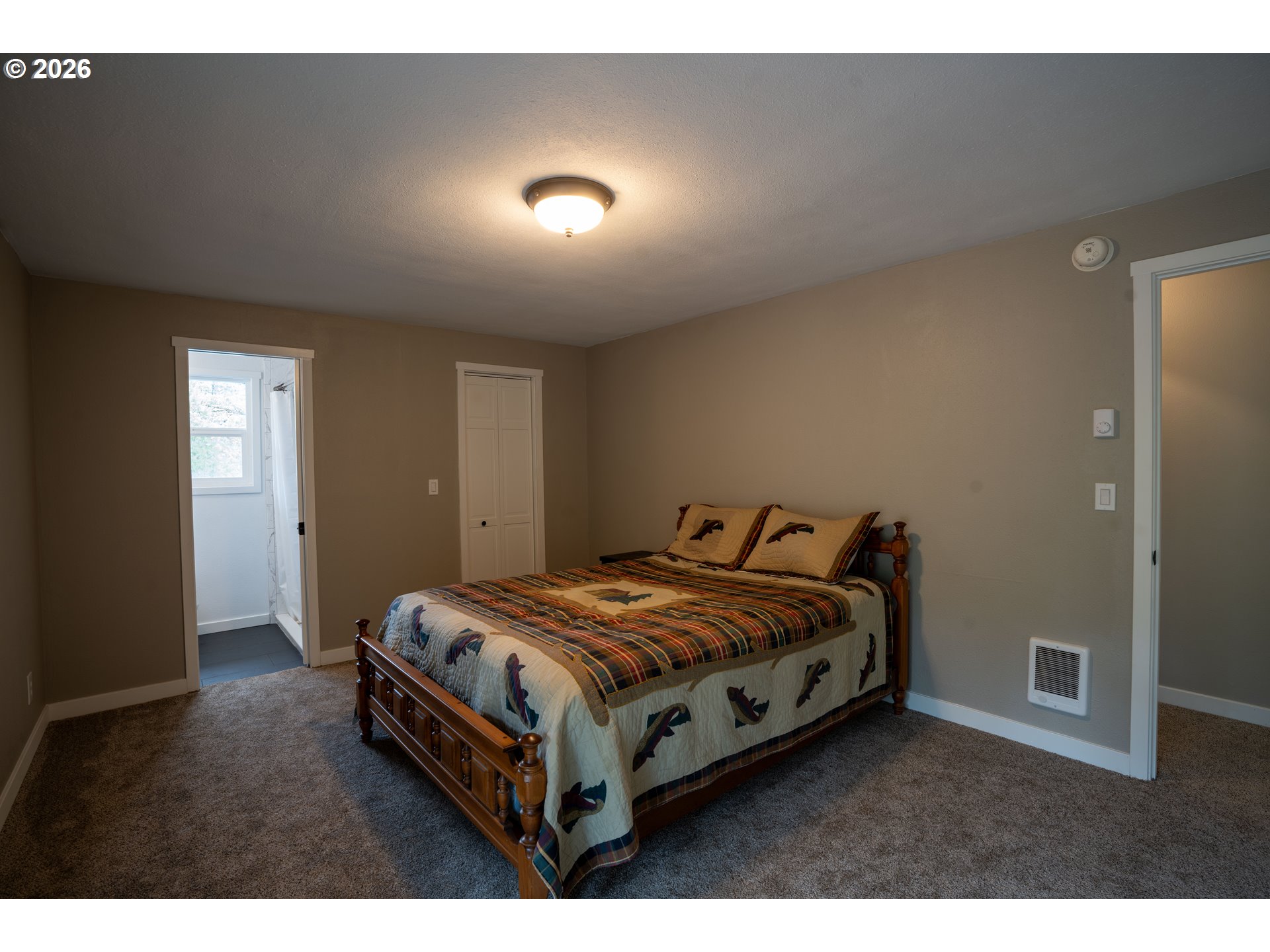 37075 Camp Creek Road Springfield, OR 97478 - Photo 22 of 48 a bedroom with a bed and a night stand